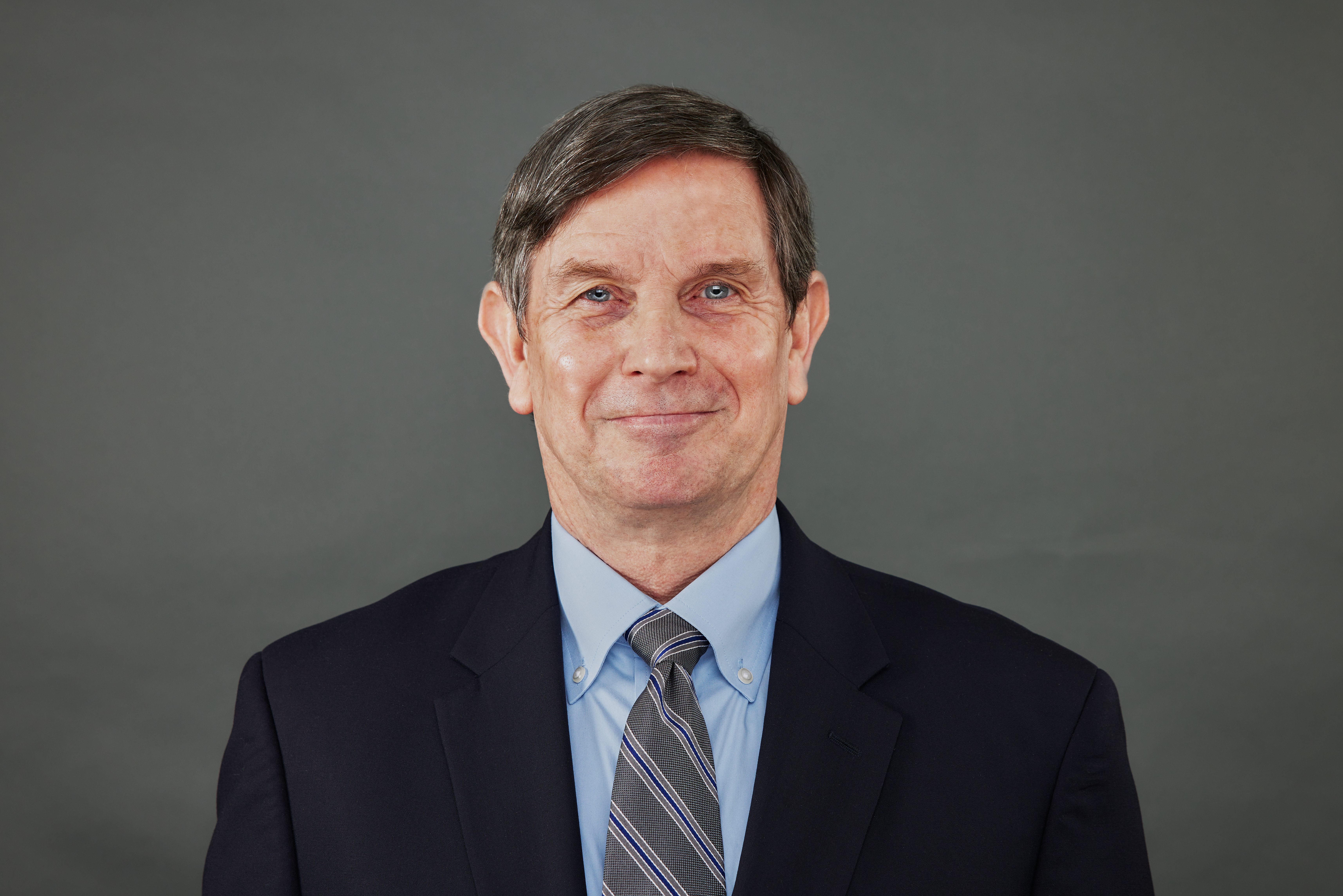 Headshot of Rogers M. Smith, a man with brown hair
